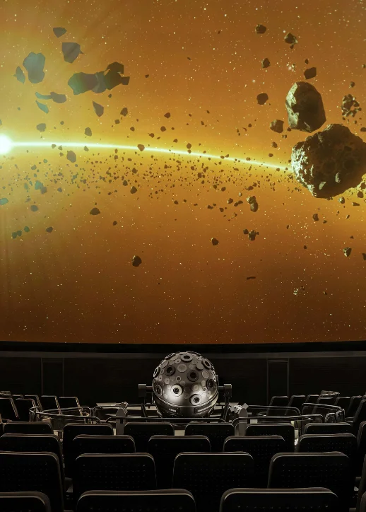 Ein großer Bildschirm zeigt eine beeindruckende Ansicht des Weltraums mit Sternen und Galaxien im Planetarium Berlin.