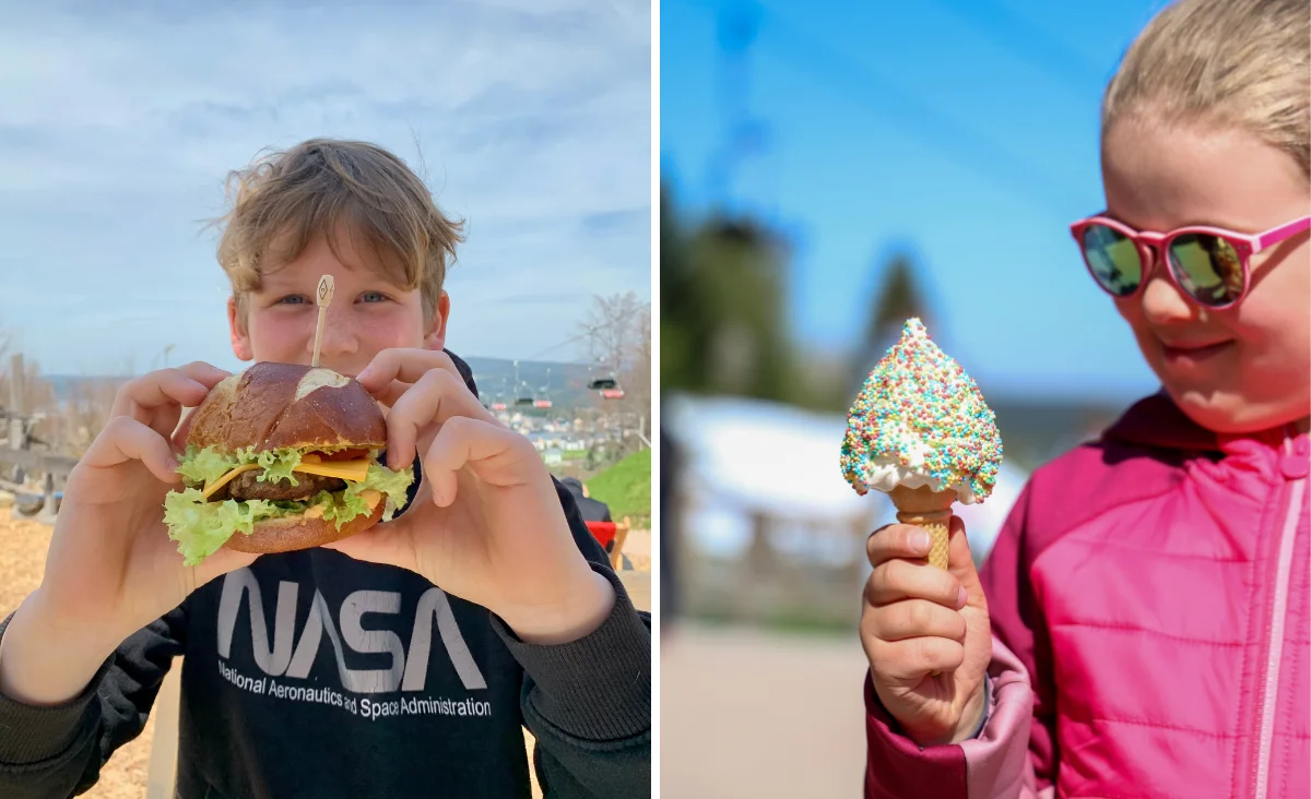 Links hält ein Kind mit blonden Haaren einen Burger mit Salat, Tomate, Käse und Brötchenhälften vor das Gesicht. Das Kind trägt ein schwarzes Oberteil mit dem weißen Aufdruck 'NASA'. Im Hintergrund sind unscharfe Strukturen und blauer Himmel zu erkennen. Rechts hält ein weiteres Kind ein großes Eis in einer Waffel, das mit bunten Streuseln bedeckt ist. Das Kind trägt eine pinke Jacke. Beide Gesichter sind unkenntlich gemacht. Die Szene spielt im Freien, vermutlich in Wurzelrudis Erlebniswelt.