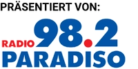 Logo mit dem Schriftzug „PRÄSENTIERT VON:“ über dem blauen und roten Markenzeichen von „RADIO 98.2 PARADISO"